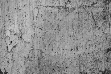 Texture of a concrete wall with cracks and scratches which can be used as a background