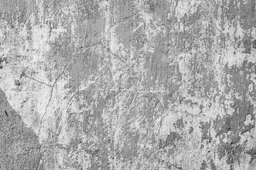Texture of a concrete wall with cracks and scratches which can be used as a background