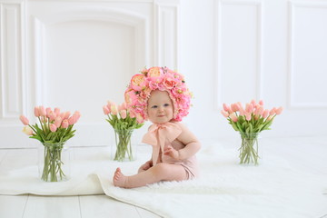 a little girl in a wreath on her head