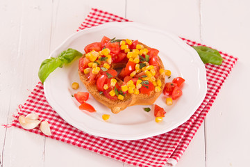 Friselle with tomatoes and mais.