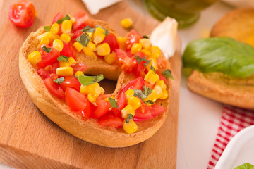 Friselle with tomatoes and mais.