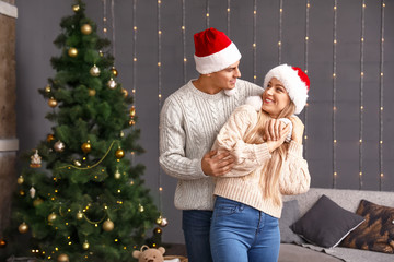 Happy couple on Christmas eve at home