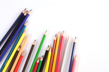 Colored pencils lie in a row