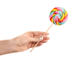 Female hand with sweet lollipop on white background