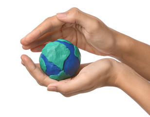 Female hands with model of Earth on white background