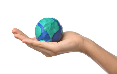 Female hand with model of Earth on white background