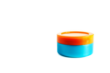 closed cosmetics jar for cream colored in 2020 trend Aqua Menthe and Lush Lava, isolated on white