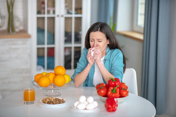 Woman having symptoms of allergy to number of products