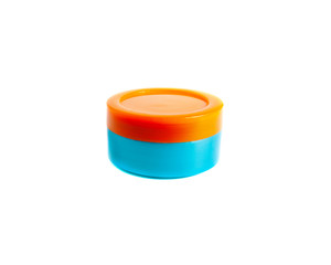 Cosmetics jar for cream colored in orange and blue, isolated on white