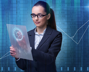 Businesswoman in stock exchange trading concept