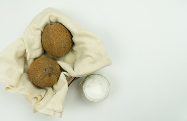 Fresh coconut oil on white table