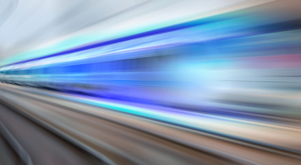 High speed train runs on rail tracks . Train in motion.