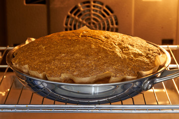 the cake is baked in the oven