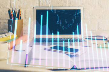 Stock market graph and table with computer background. Double exposure. Concept of financial analysis.