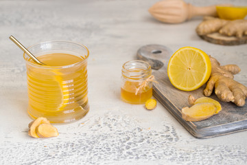 Ginger tea with honey and lemon. Warm revitalizing beverage used to help relieve cold and flu symptoms.