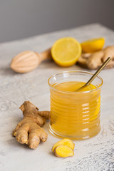 Ginger tea with honey and lemon. Warm revitalizing beverage used to help relieve cold and flu symptoms.