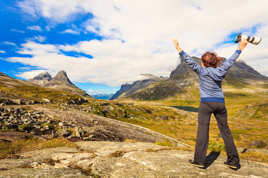 Happy tourist looking at mountains nature, Norway