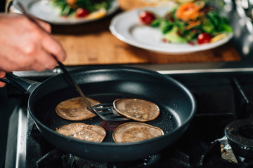 Chef Frying Dough in Pan