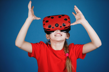 Girl plays with virtual reality glasses