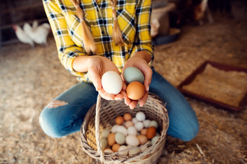 Proud chicken farmer showing the eggs her hens produced
