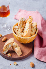 Italian tuscan traditional cookies cantuccini with desert wine in glass.