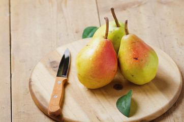 Fresh organic ripe pears on wooden   board.