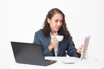 Beautiful young executive with her work and coffee