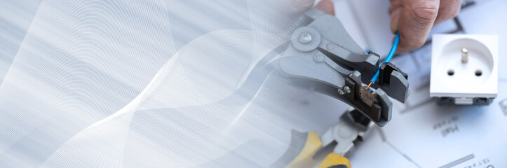 Electrician stripping a wire; panoramic banner