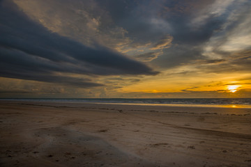 Beach and dramatic sunset. Gunn Point beach, Darwin, Australia, 03/17/19.