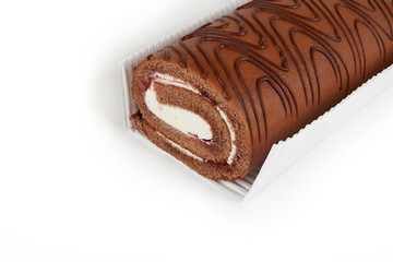 Chocolate biscuit roll cake in package, isolated on white background.