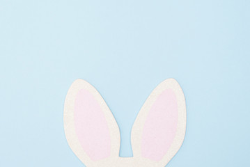 Bunny rabbit ears on bright blue background. Easter minimal concept
