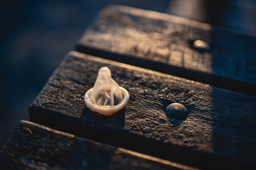 Condom on the table in daylight.