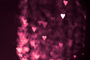 pink or red abstract background with hearts bokeh