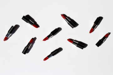 Flat lay composition, Lipsticks on white background with shadow. Beautiful Make-up concept