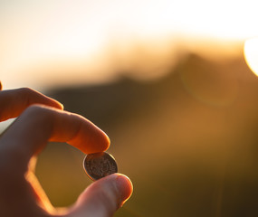 Person holding Loose change, coins.