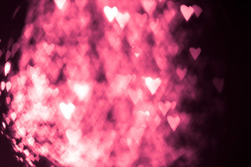 pink or red abstract background with hearts bokeh