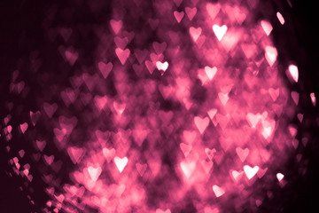 pink or red abstract background with hearts bokeh