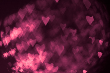 pink or red abstract background with hearts bokeh