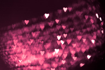 pink or red abstract background with hearts bokeh