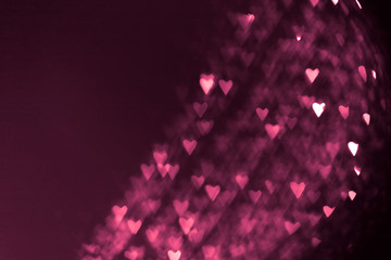 pink or red abstract background with hearts bokeh