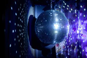Mirror ball for disco with highlights and color lighting, disco.
