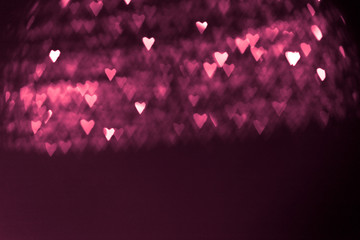 pink or red abstract background with hearts bokeh