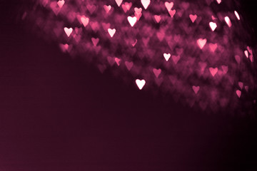 pink or red abstract background with hearts bokeh