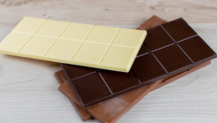 Delicious white, black, hazelnut and milk chocolate flavored chocolate tablets