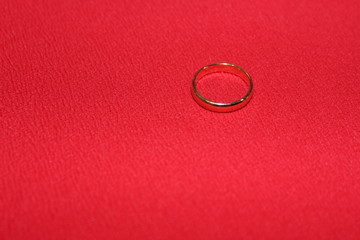 One engagement ring on a red background. Family jewels. Wedding ring