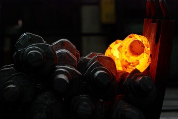 pile of hot steel parts. crankshaft production