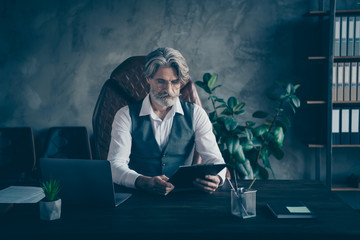 Concentrated pensive strict old man grandfather company owner sit table chair have job interview...