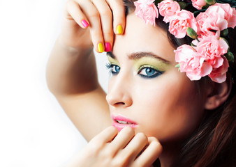 young pretty brunette woman with pink flowers and manicure posing cheerful isolated on white background closeup