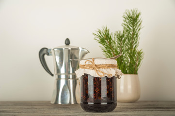 Natural organic jam from pine cones in a jar close-up. Organic jam for health and copy space.