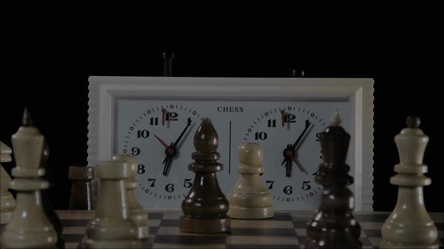 the chess clock is working in the background of unfocused blurred static chess